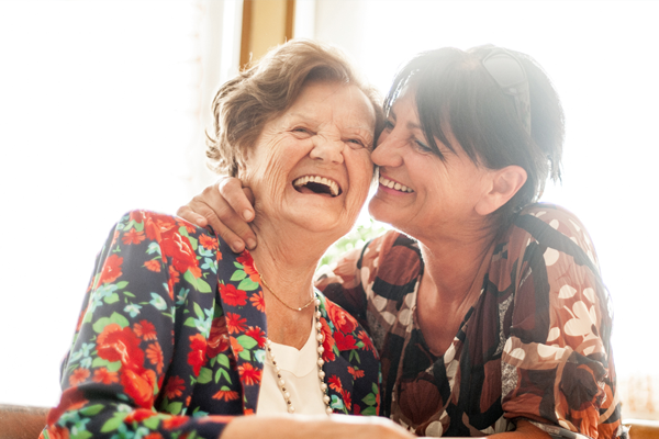 mother and daughter smiling